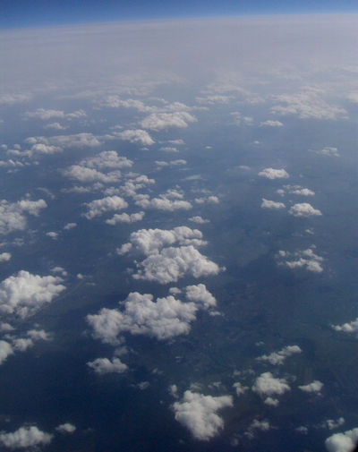 Aerial view of landscape against blue sky