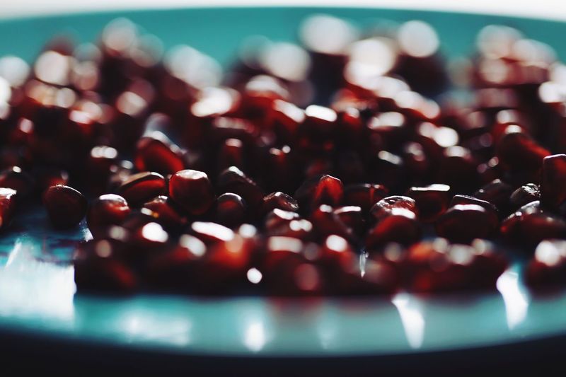 Close-up of pomegranate seed in plate