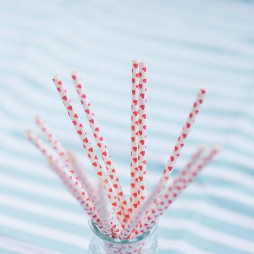 Close-up of heart shapes on drinking straws
