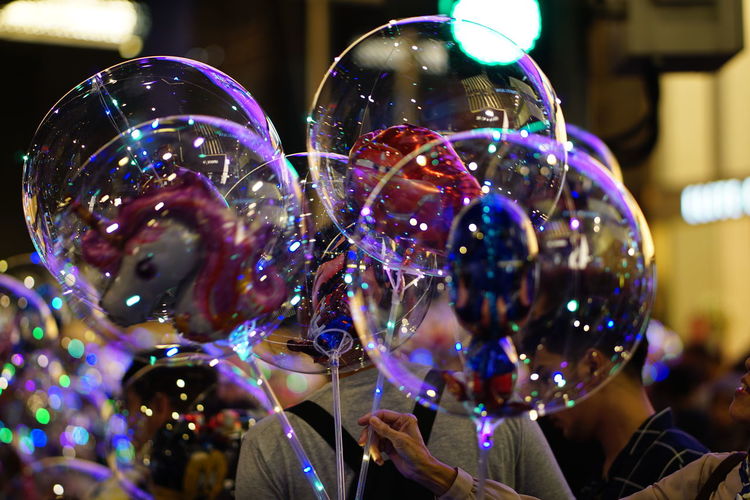 Close-up of bubbles with reflection in illuminated lights