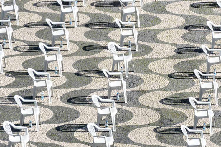 High angle view of chairs in row