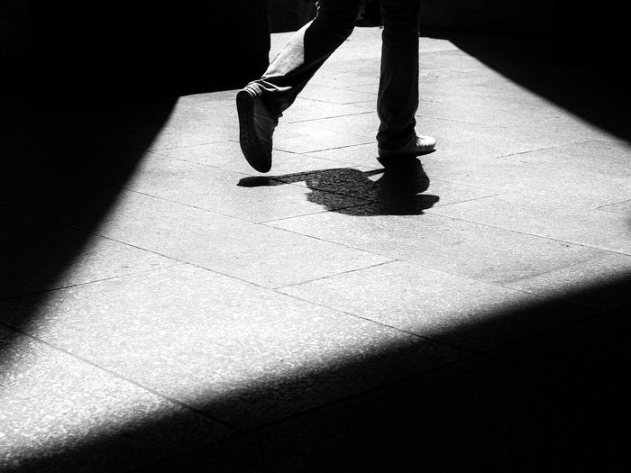 Low section of woman standing on ground