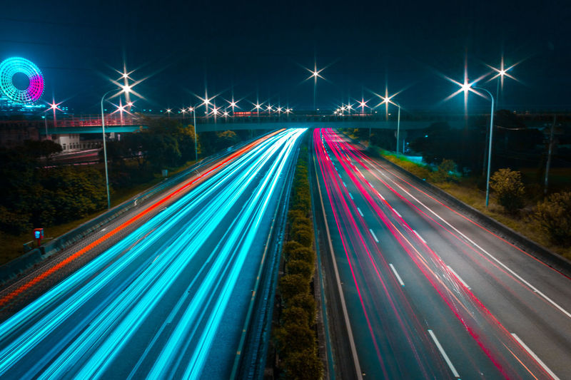 High angel view of light trails on highway at night