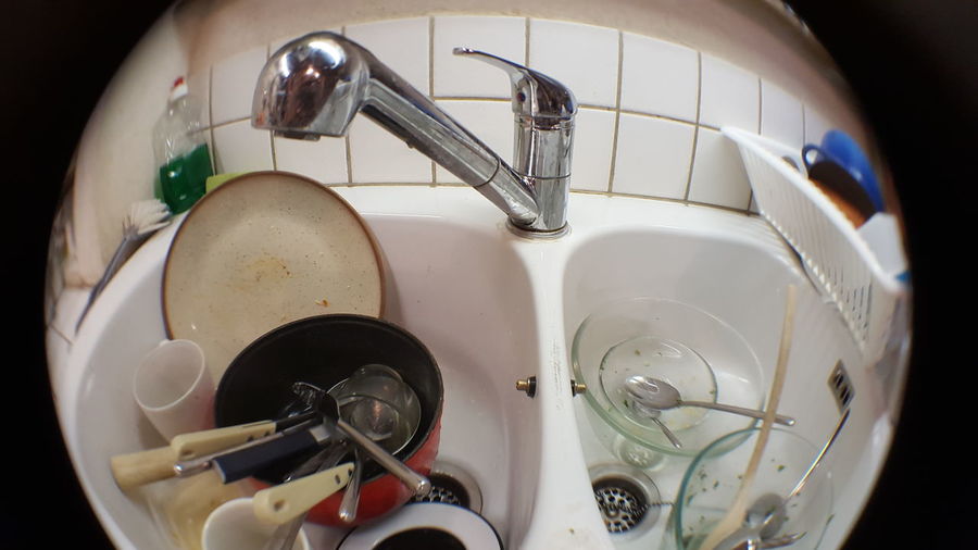High angle view of dirty dishes in sink