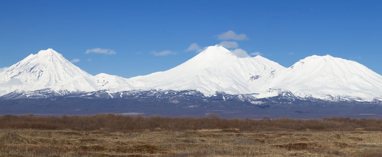 The panorama koryaksky avachinsky kozelsky volcanoes of kamchatka peninsula