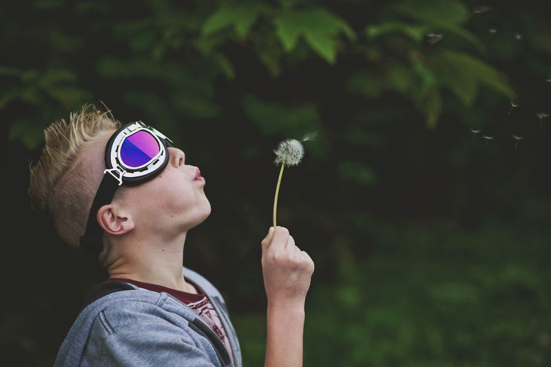 Low angle view of girl wearing sunglasses