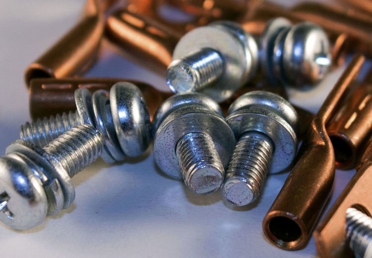 Close-up of nut and bolt against white background