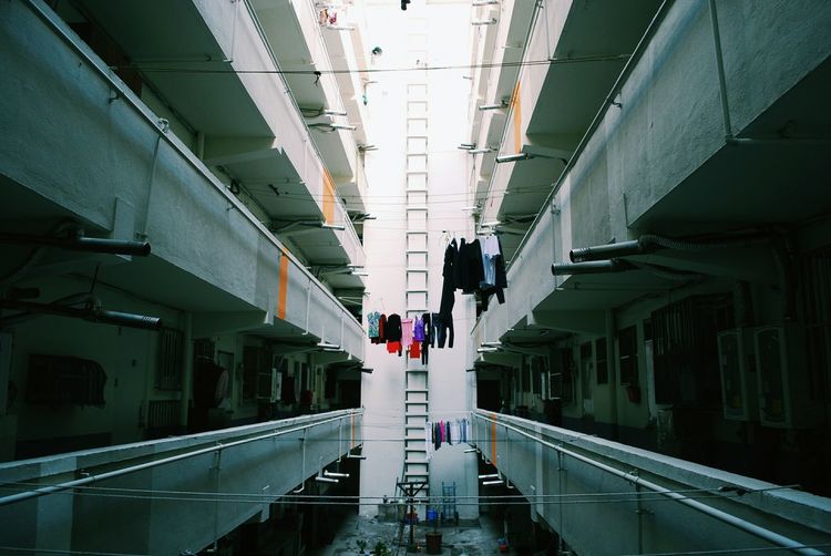 Laundry drying on clothesline amidst building