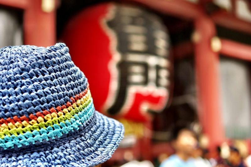 Cropped image of person wearing colorful hat