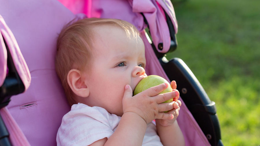 Cute girl eating apple