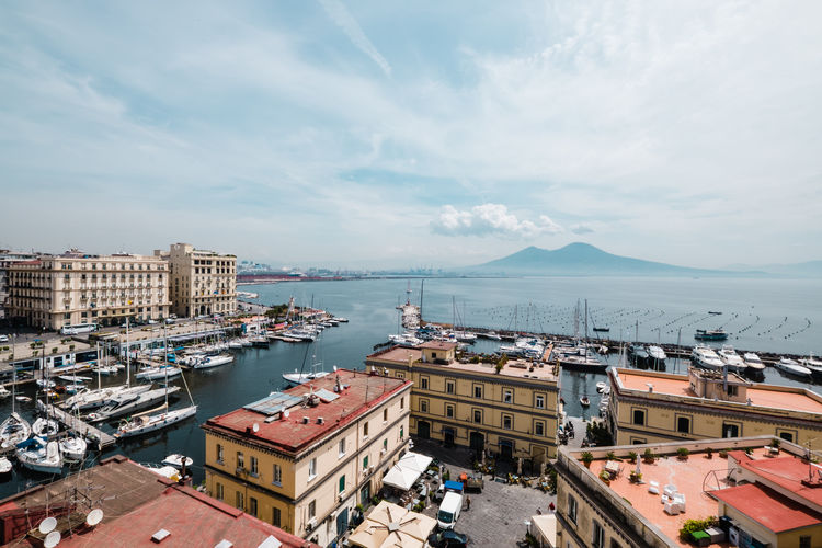 High angle view of naples by buildings against sky