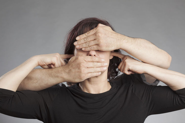 Close-up of hands against white background