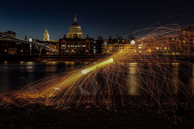 Light trails on city buildings at night