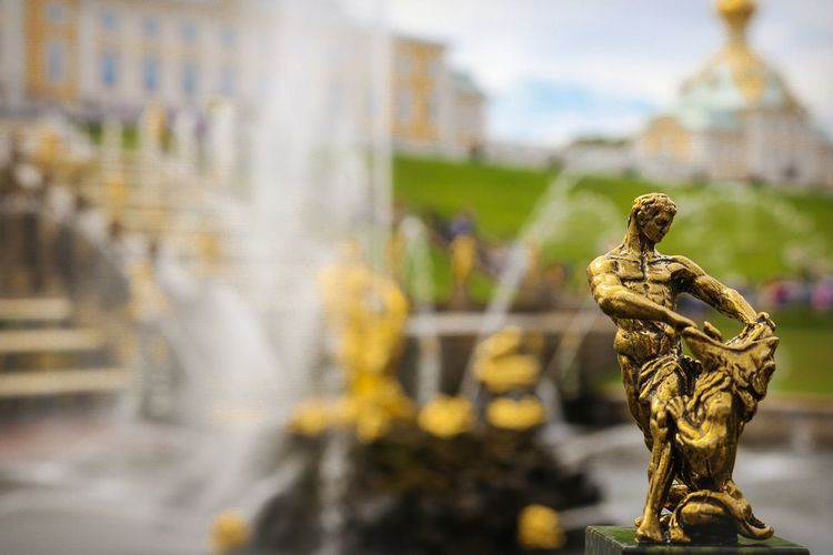 Close-up of miniature samson and lion gold statue at peterhof palace