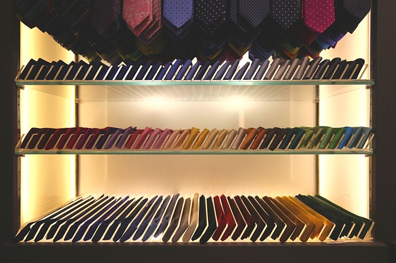 Neckties arranged on shelves in store