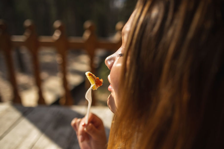 Close-up of woman eating food