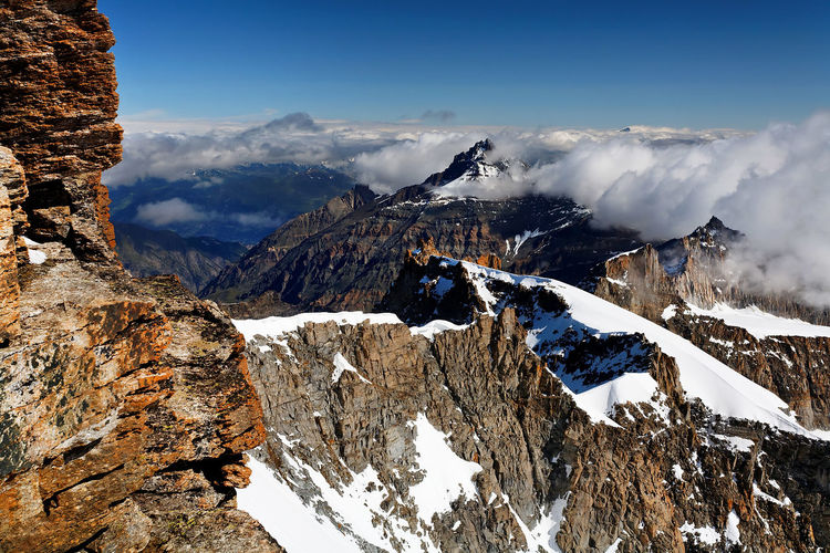 Scenic view of rocky mountains during winter at gran paradiso national park