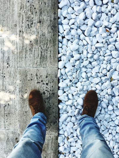 Low section of man standing on street