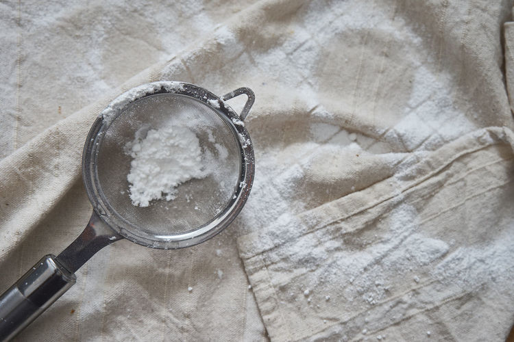Close-up of powdered sugar in tea strainer