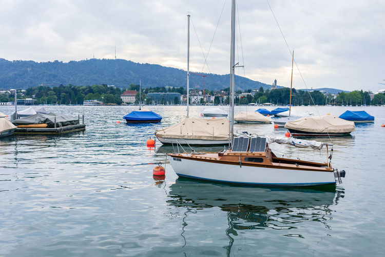 Boats in sea against sky