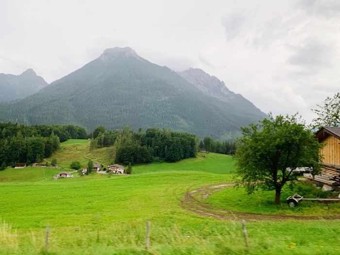 Scenic view of landscape and mountains against sky