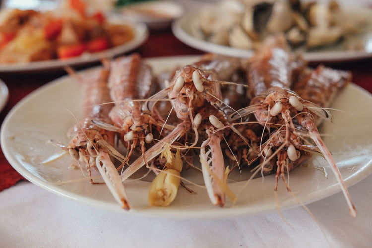 Close-up of mantis shrimps in plate on table