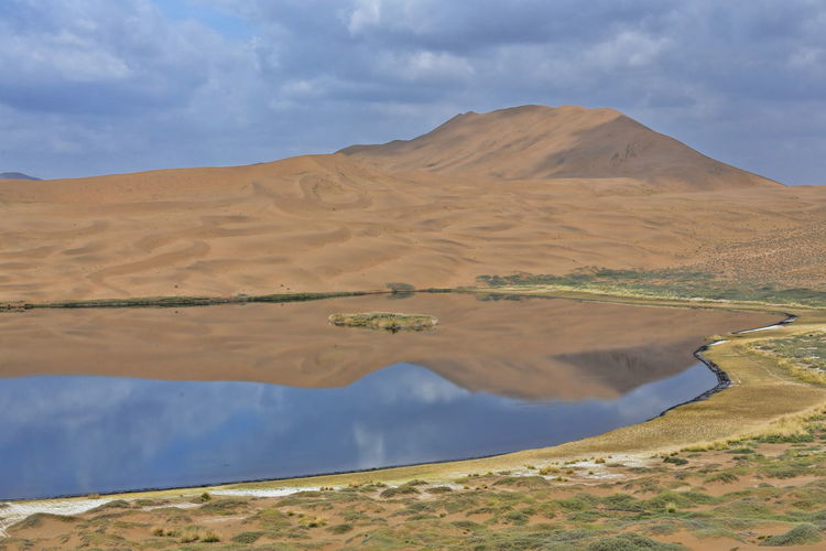 1078 lake zhalate-badain jaran desert-nomadic yurts-dune and sky reflection. inner mongolia-china.