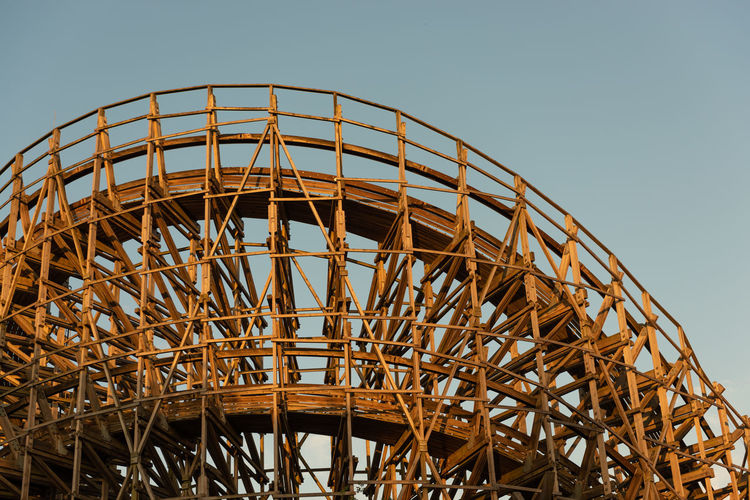 Curve of a large wooden roller coaster

