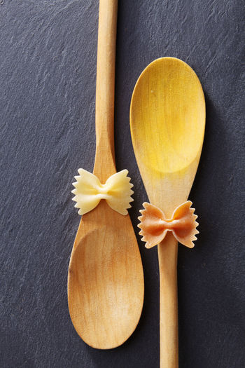 Directly above shot of farfalle pastas on spoons