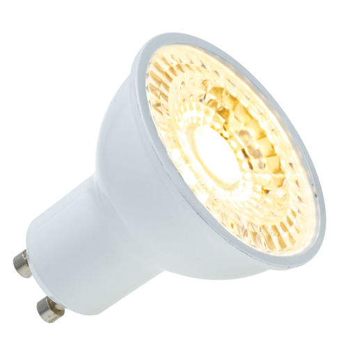 Close-up of illuminated light bulb against white background