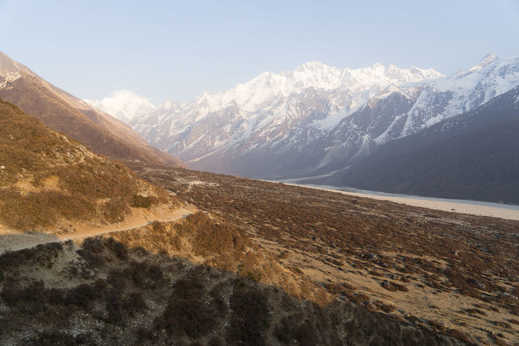 Scenic view of snowcapped mountains against sky