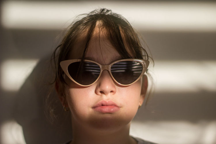 Close-up of young woman wearing sunglasses