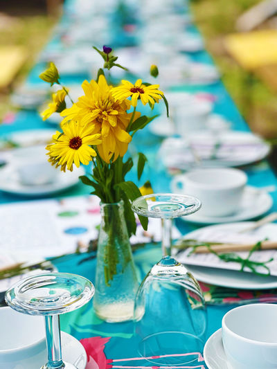 Festive table outdoor with flowers-close up