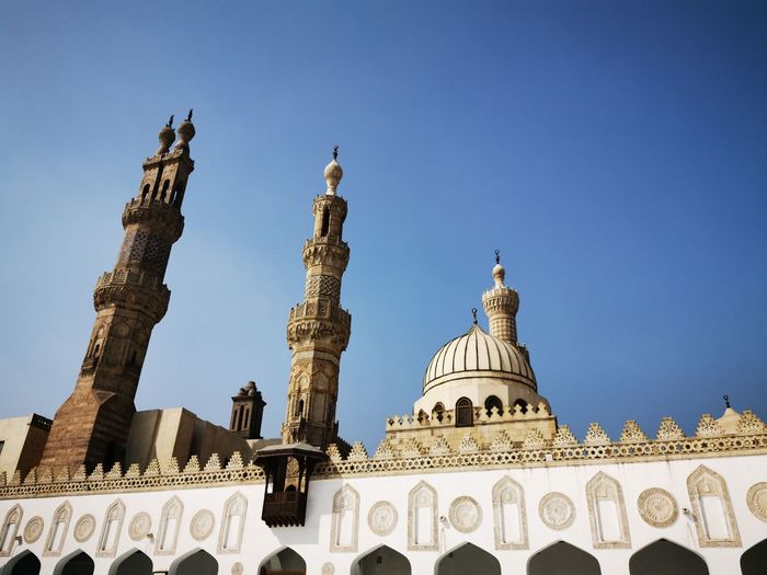 Low angle view of mosque against clear sky