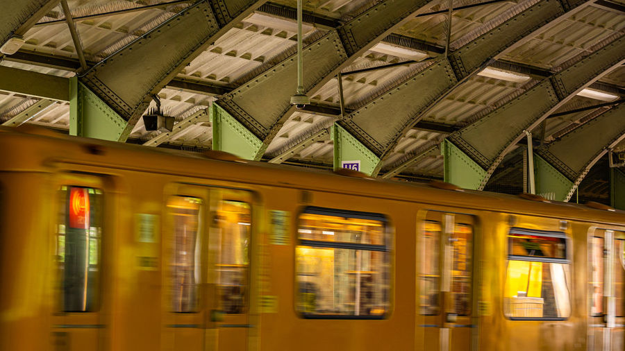 Train at railroad station platform in city