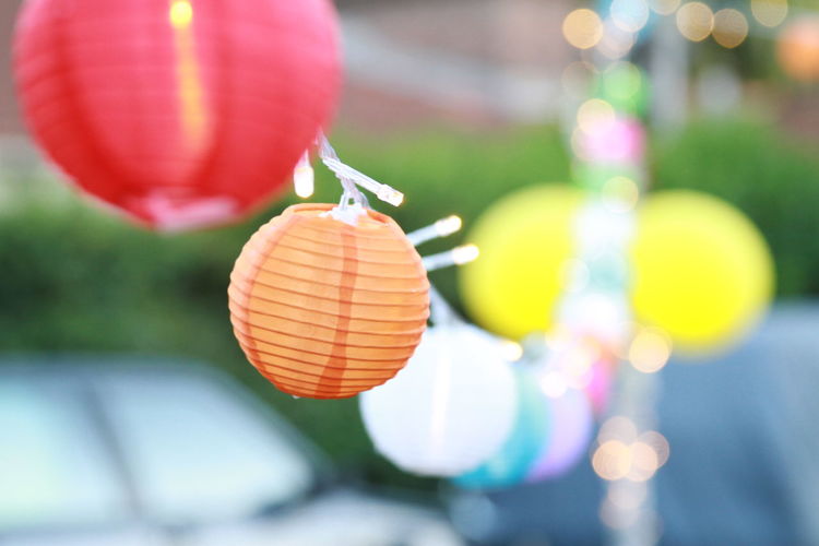 Close-up of lantern hanging against blurred background