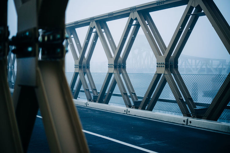 Closeup of an iron bridge at deep fog