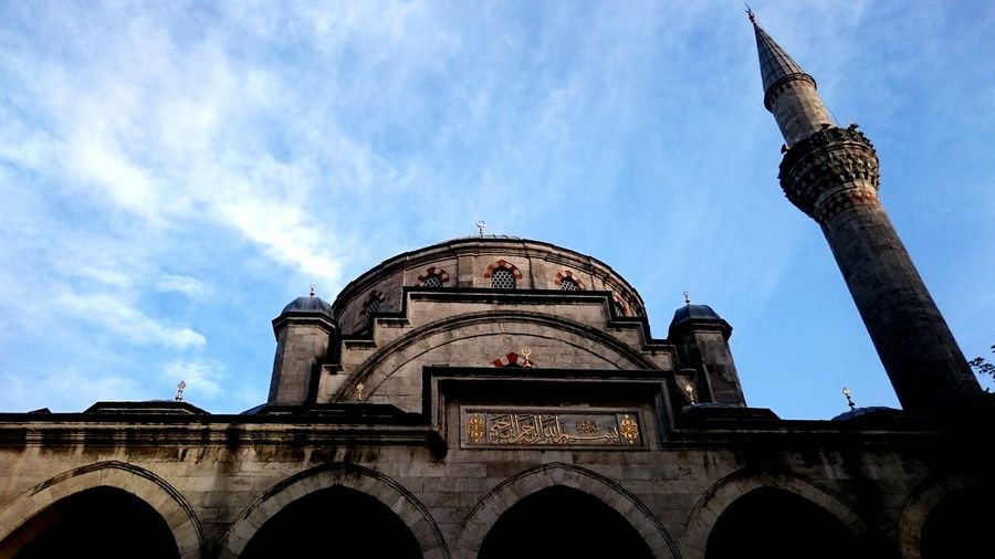 Low angle view of sisli mosque against sky