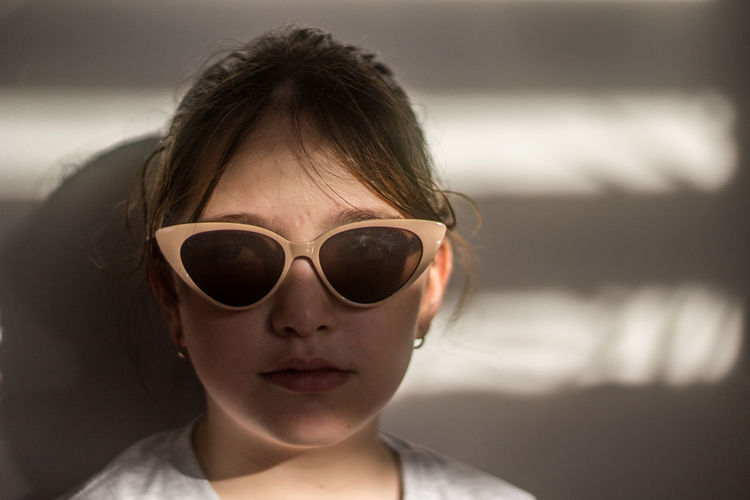 Portrait of young woman wearing sunglasses