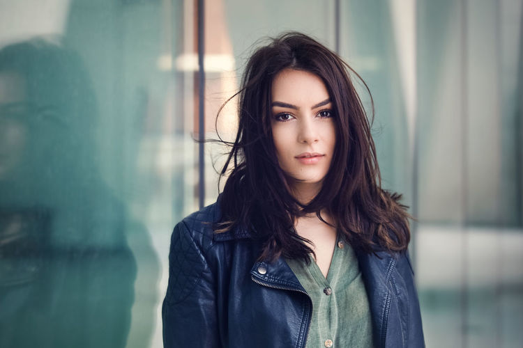 Portrait of hipster modern young woman with leather jacket