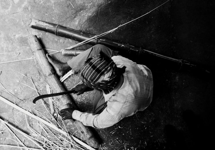 High angle view of men working on wood