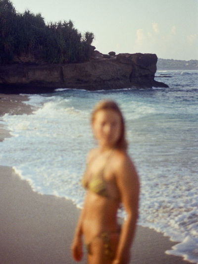 Girl at the beach in nusa lembongan, indonesia. shot on 35mm kodak gold 200 film.