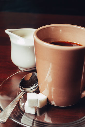 Close-up of coffee cup on table