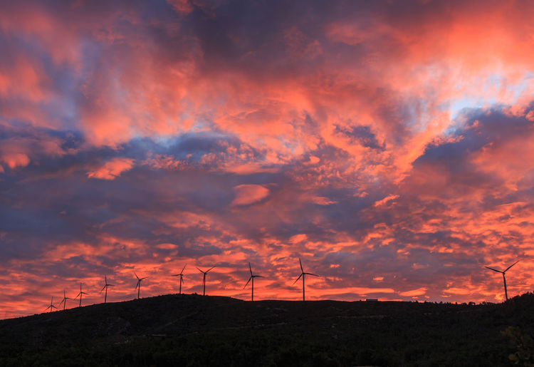 Group of windmills in mountain at sunrise