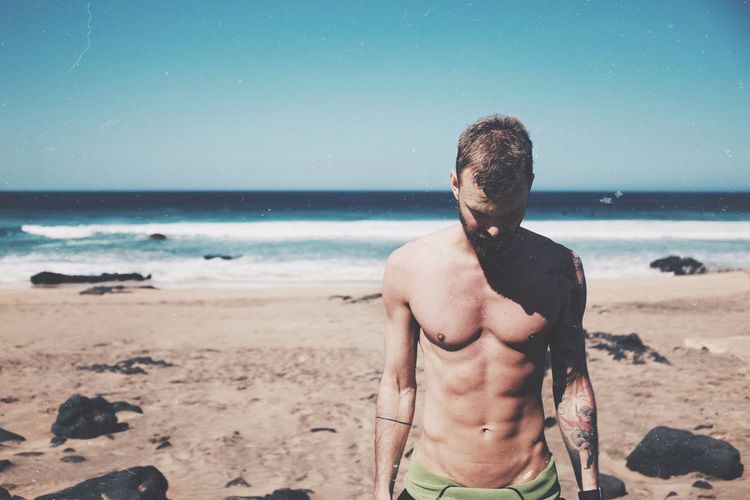 Shirtless man at beach