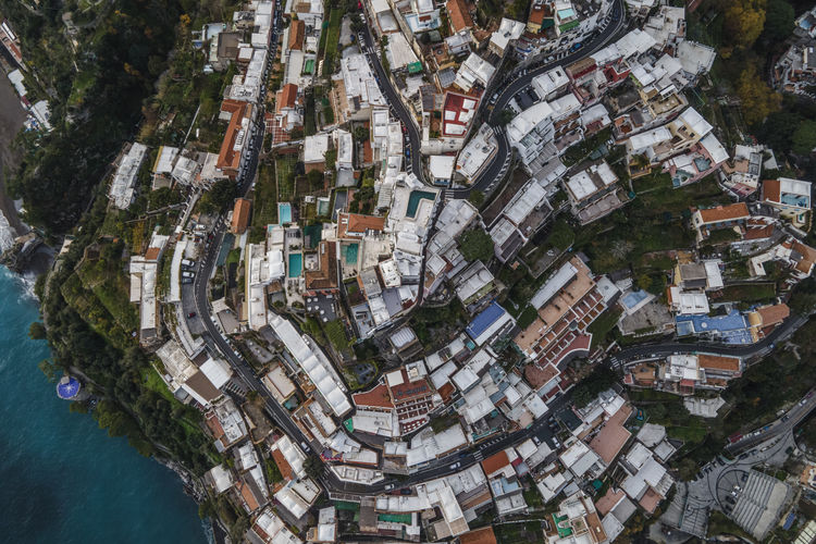 Italy, province of salerno, positano, drone view of hillside town on amalfi coast