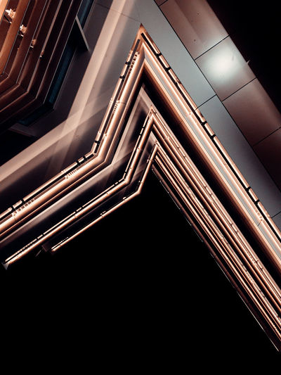 Low angle view of illuminated building against sky