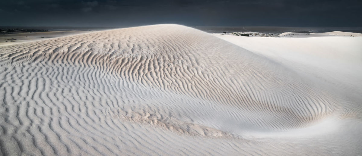 Scenic view of desert land during winter