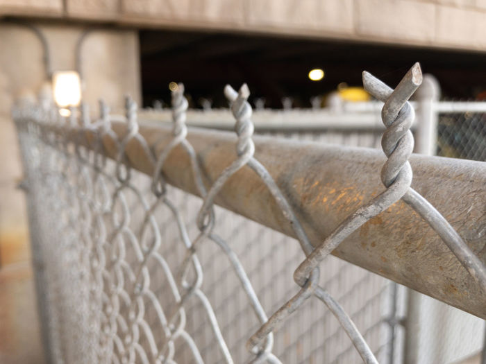 Close up of chain link fence sharp ends