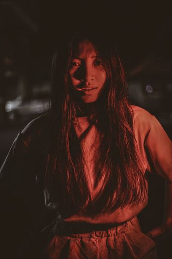 Portrait of woman with red light